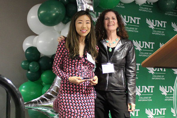 Lisa Jeon receiving award from Patricia Cukor-Avila
