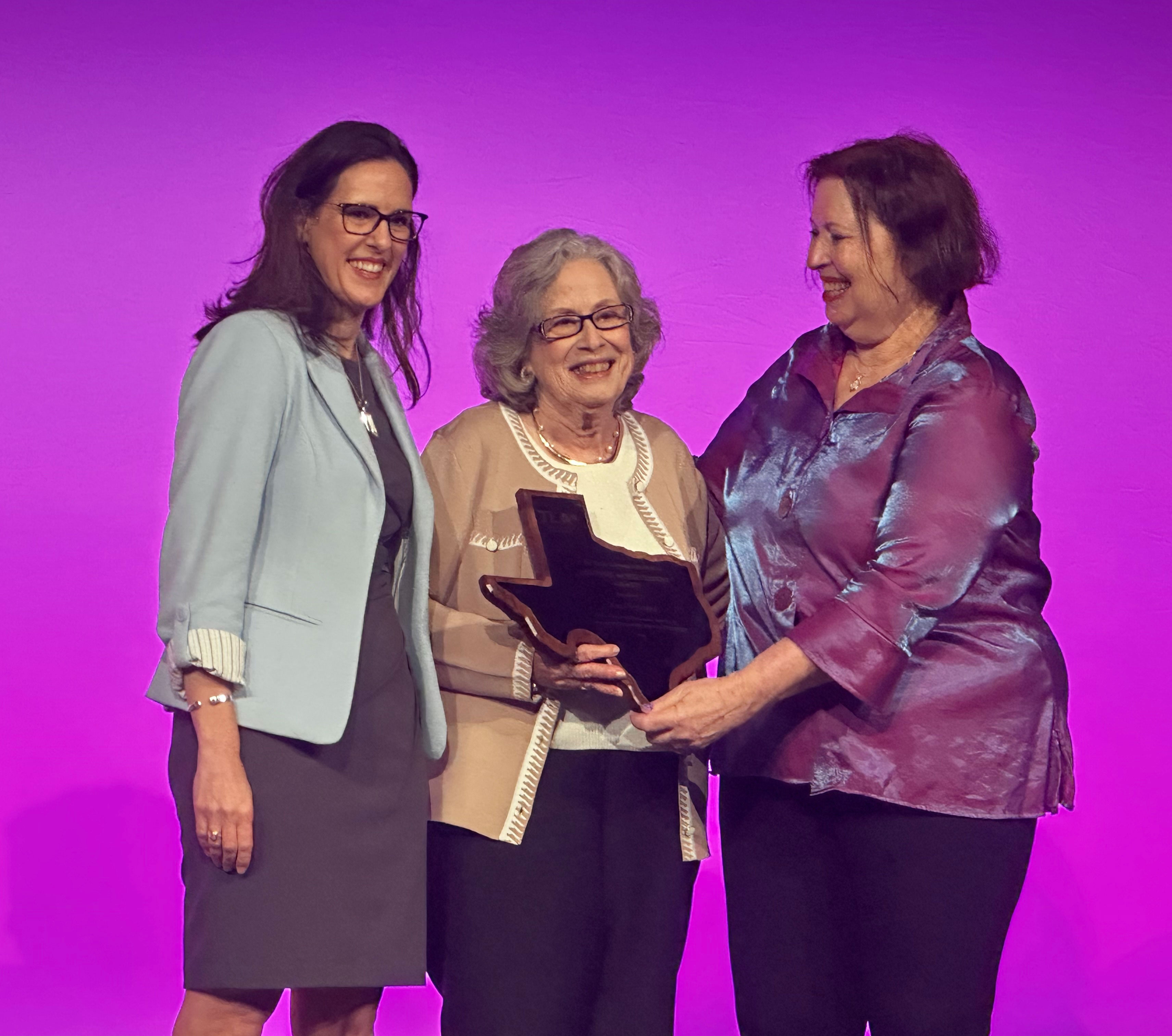 Dr. Ana Cleveland receiving an award.