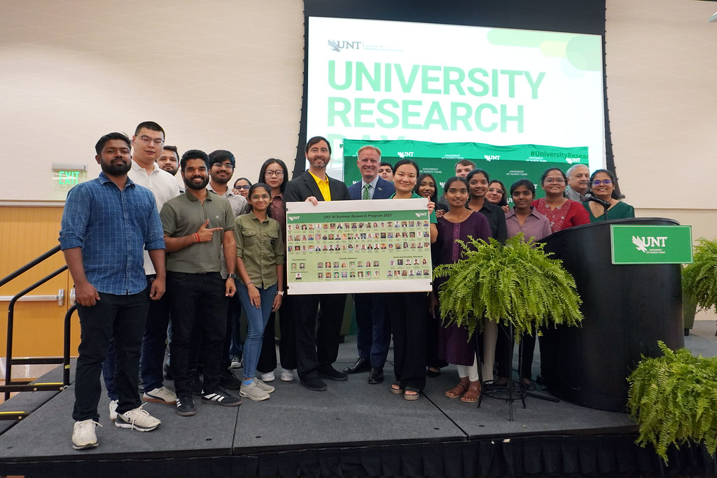 Group of students posing on stage at UNT Research Day